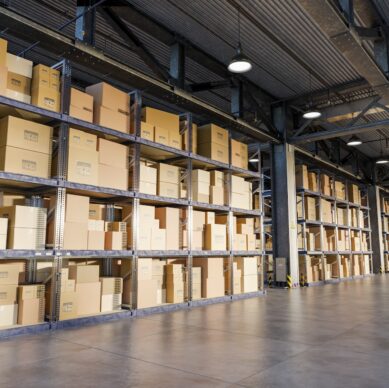 3D illustration. Cardboard boxes on storage warehouse shelves. Industry, logistics and shipping concept.